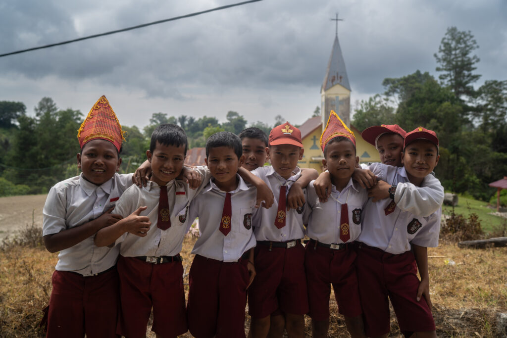 Batak children leaving school.